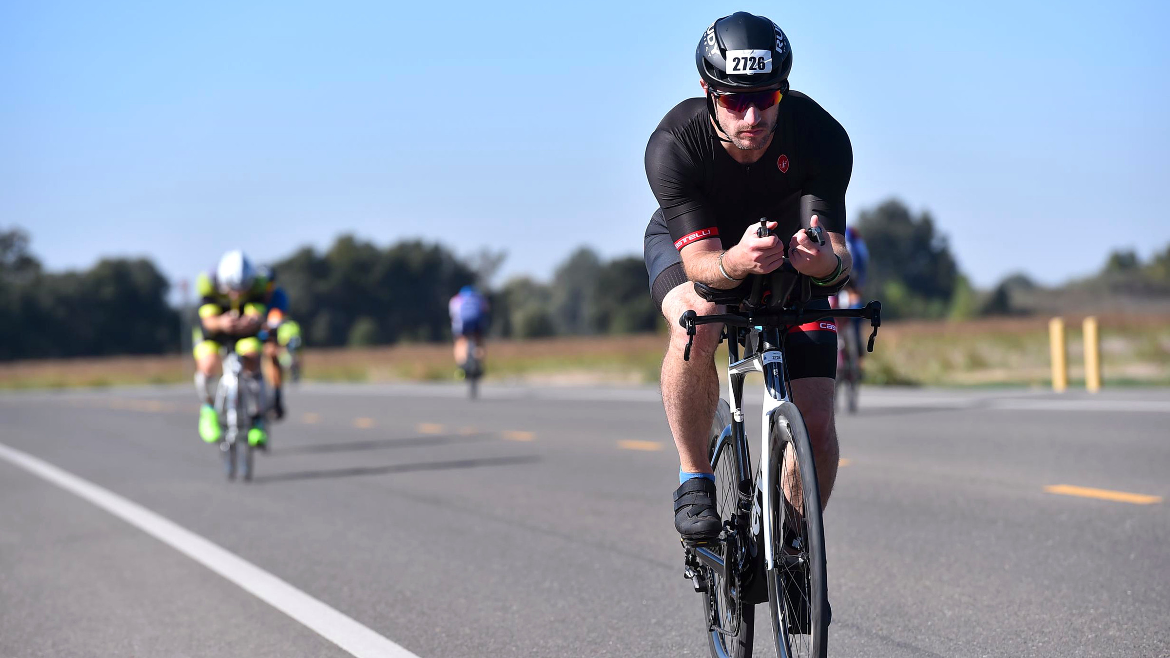 Erik Hurley racing the cycling leg of a triathlon